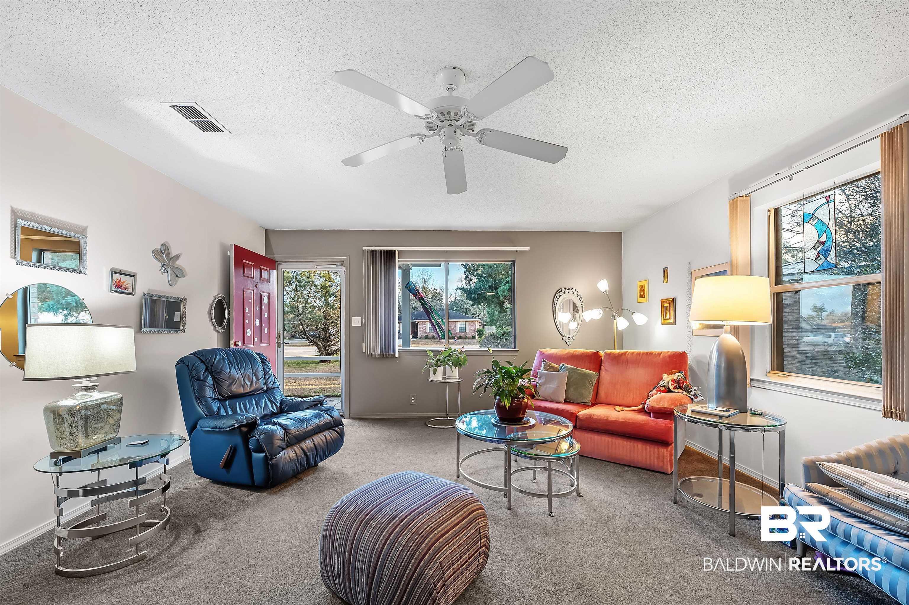526 Ariel Avenue Foley, AL 36535 - Photo 7 of 33 Carpeted living room with ceiling fan and a textured ceiling