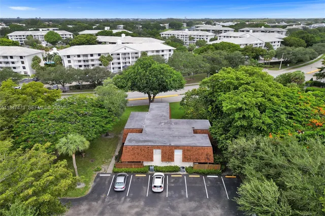 an aerial view of a house with a garden