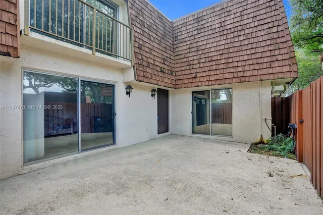 a view of backyard with seating space