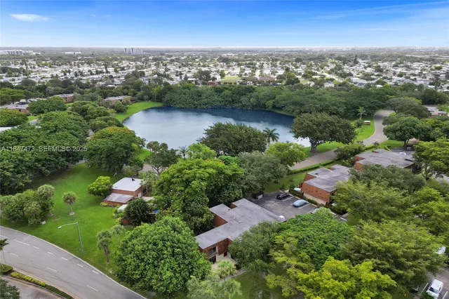 an aerial view of city and lake