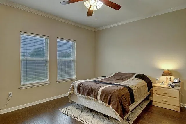 a bedroom with a bed and window