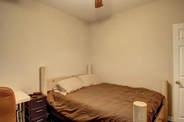 a view of a bathroom with a shower and a door