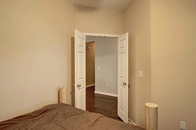 a bedroom with furniture and a window