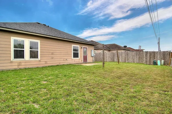 a backyard of a house with lots of green space