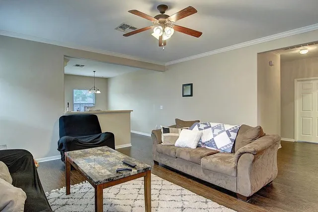 a living room with furniture and a window