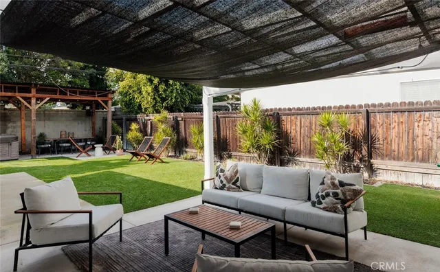a patio with yard table and chairs