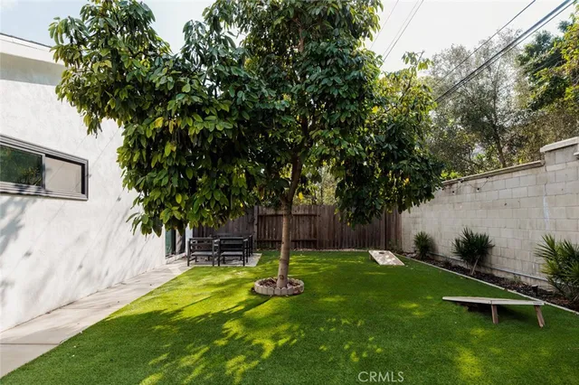 a view of a backyard with a small cabin