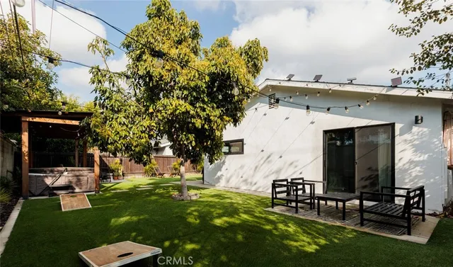 a view of a chair and table in the garden