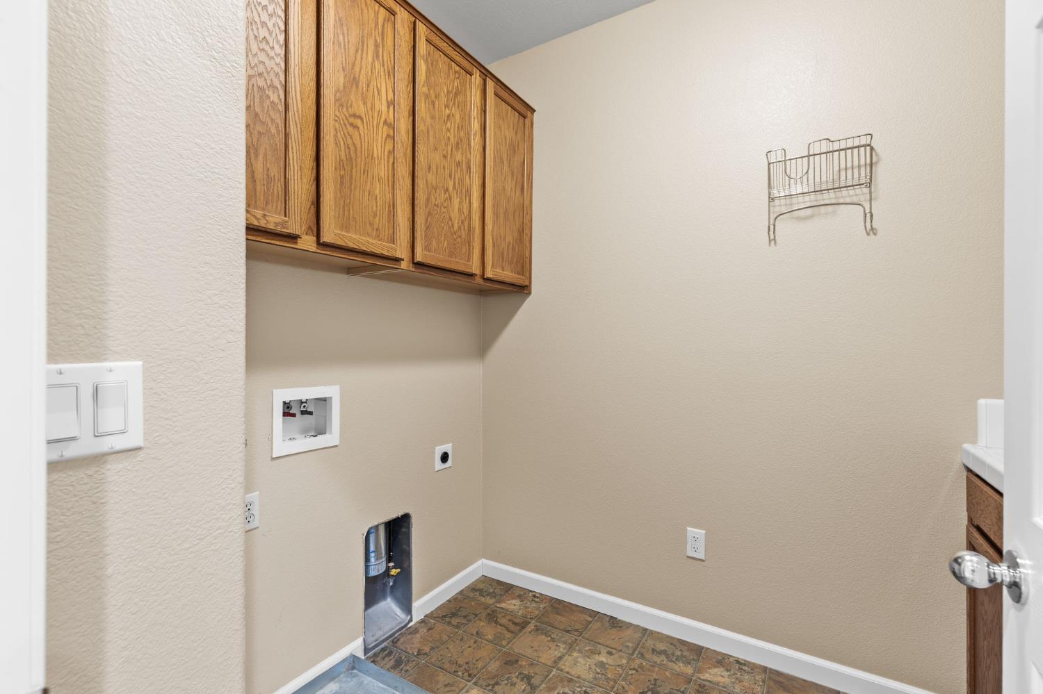 3103 Leiper Loop Lincoln, CA 95648 - Photo 20 of 27 Upstairs laundry room with ample amount of cabinets.