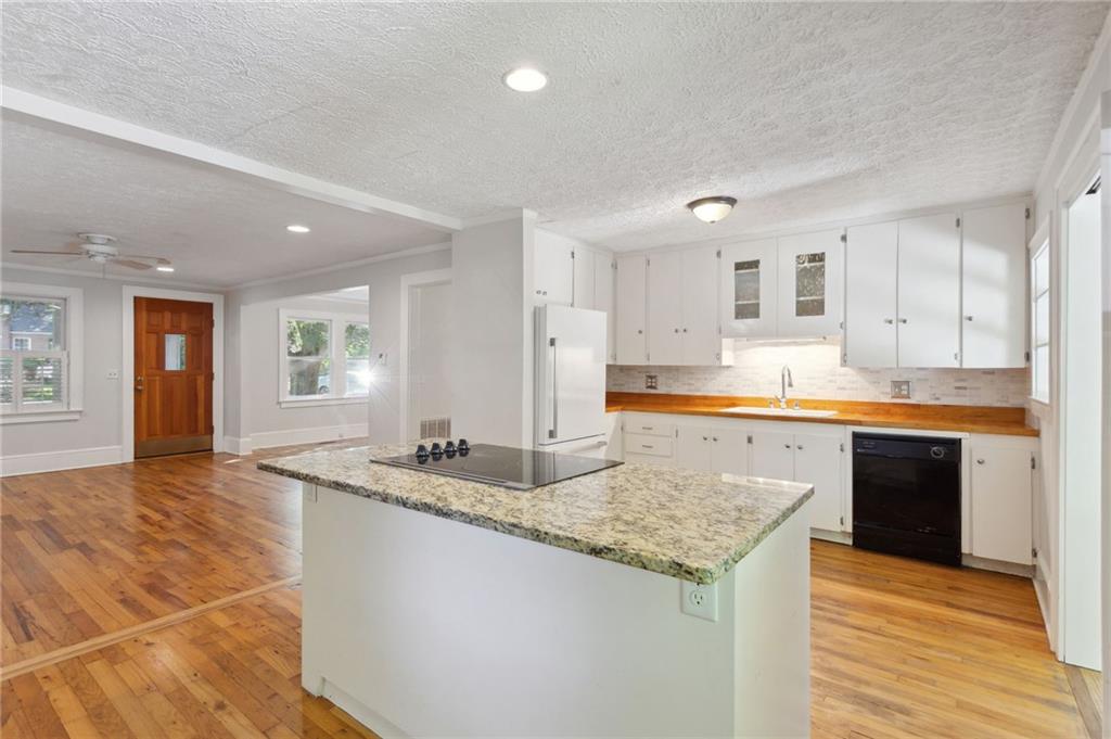 385 Sunset Drive Athens, GA 30606 - Photo 17 of 48 a kitchen with granite countertop a sink and cabinets
