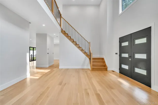 a view of an entryway with wooden floor
