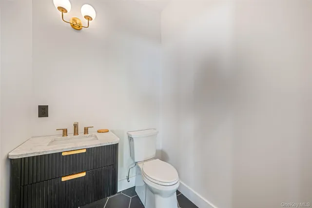 a bathroom with a toilet and a sink