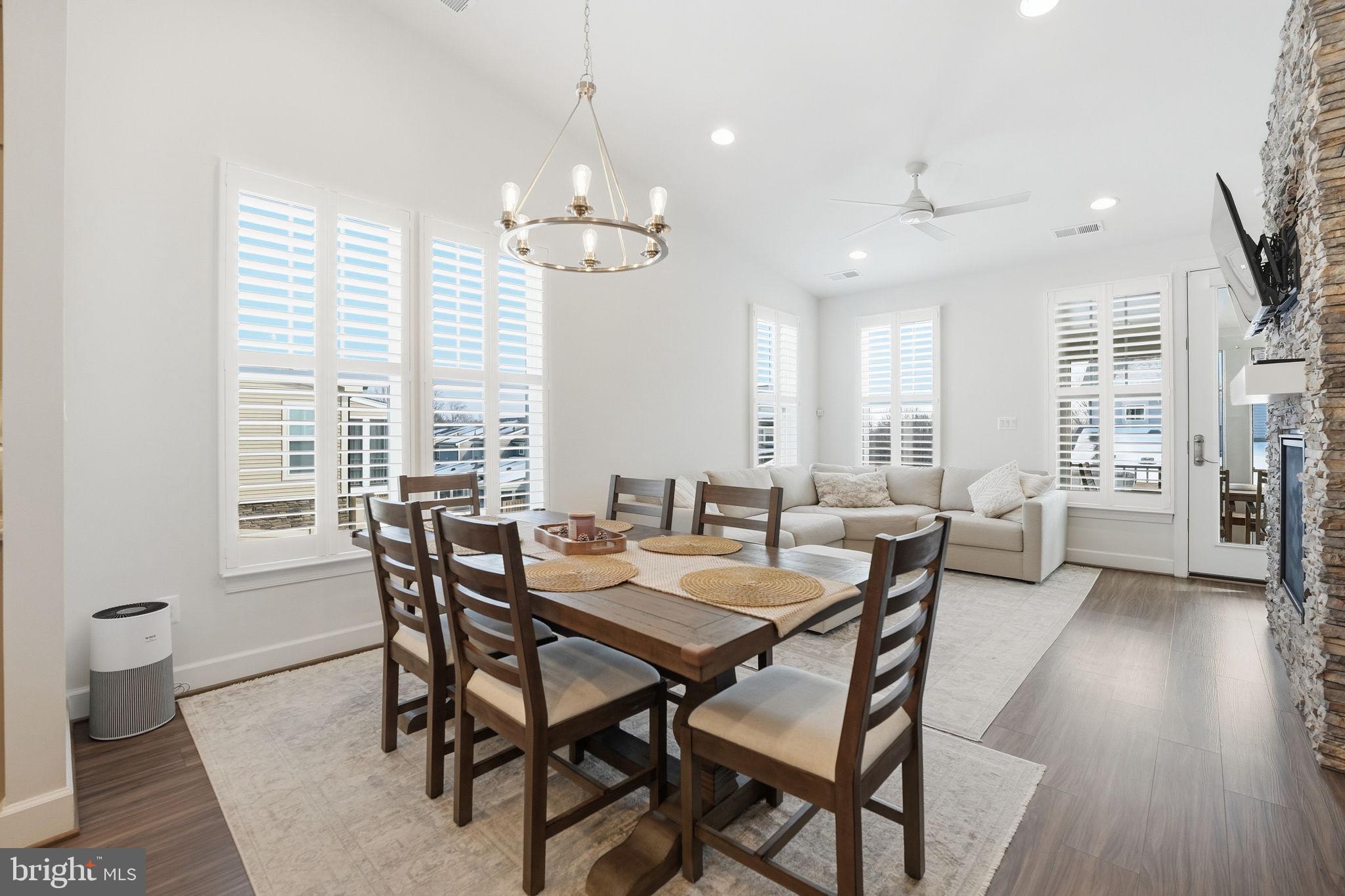 151 Windflower Way Stafford, VA 22554 - Photo 13 of 88 a view of a dining room with furniture and wooden floor