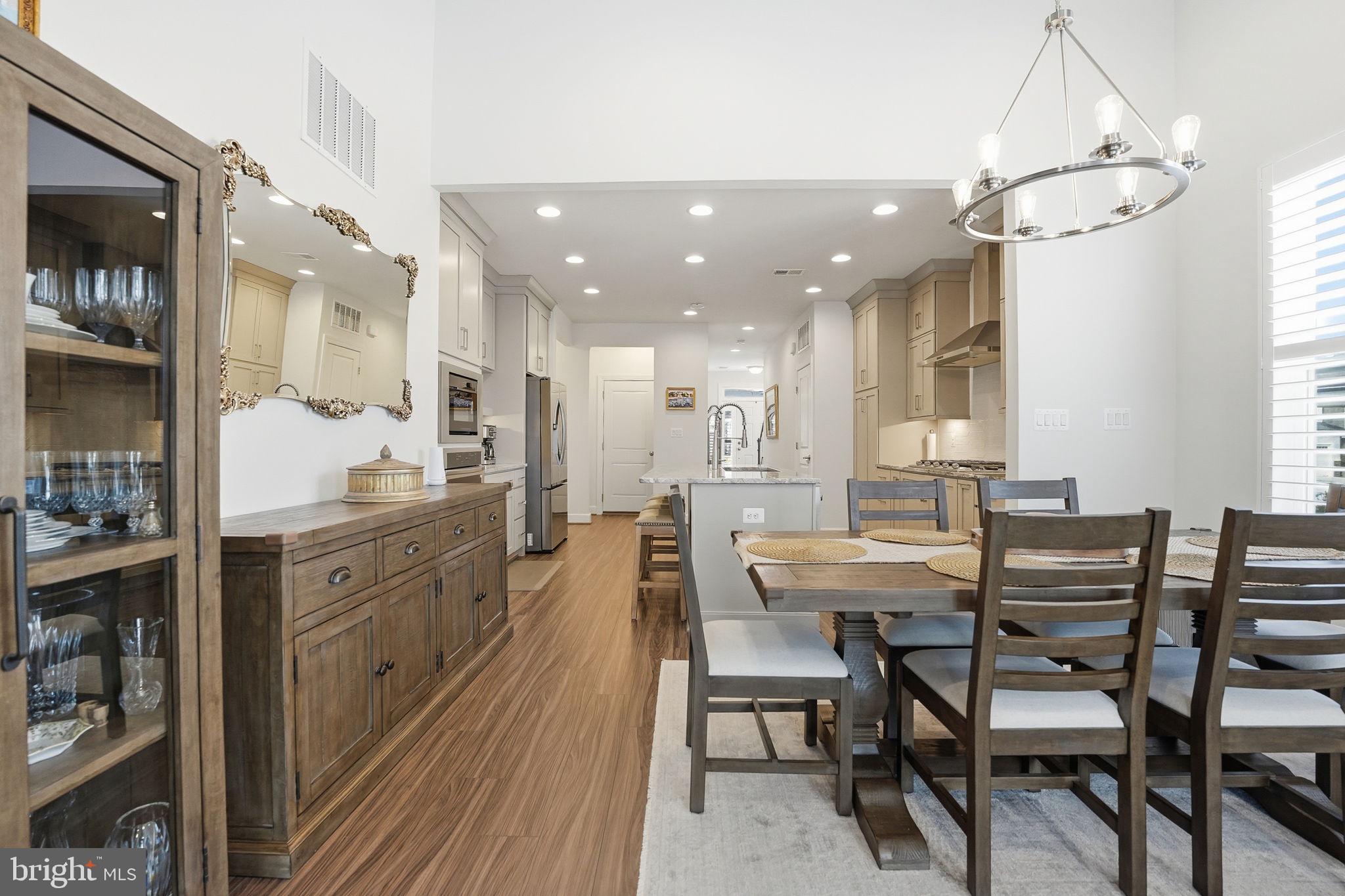 151 Windflower Way Stafford, VA 22554 - Photo 14 of 88 a large kitchen with a table and chairs