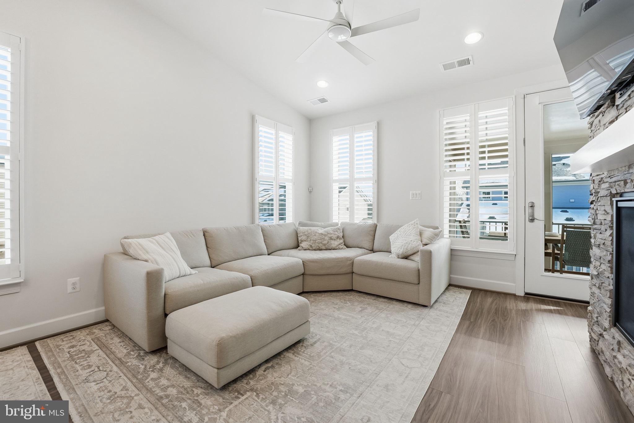 151 Windflower Way Stafford, VA 22554 - Photo 16 of 88 a living room with furniture and a flat screen tv