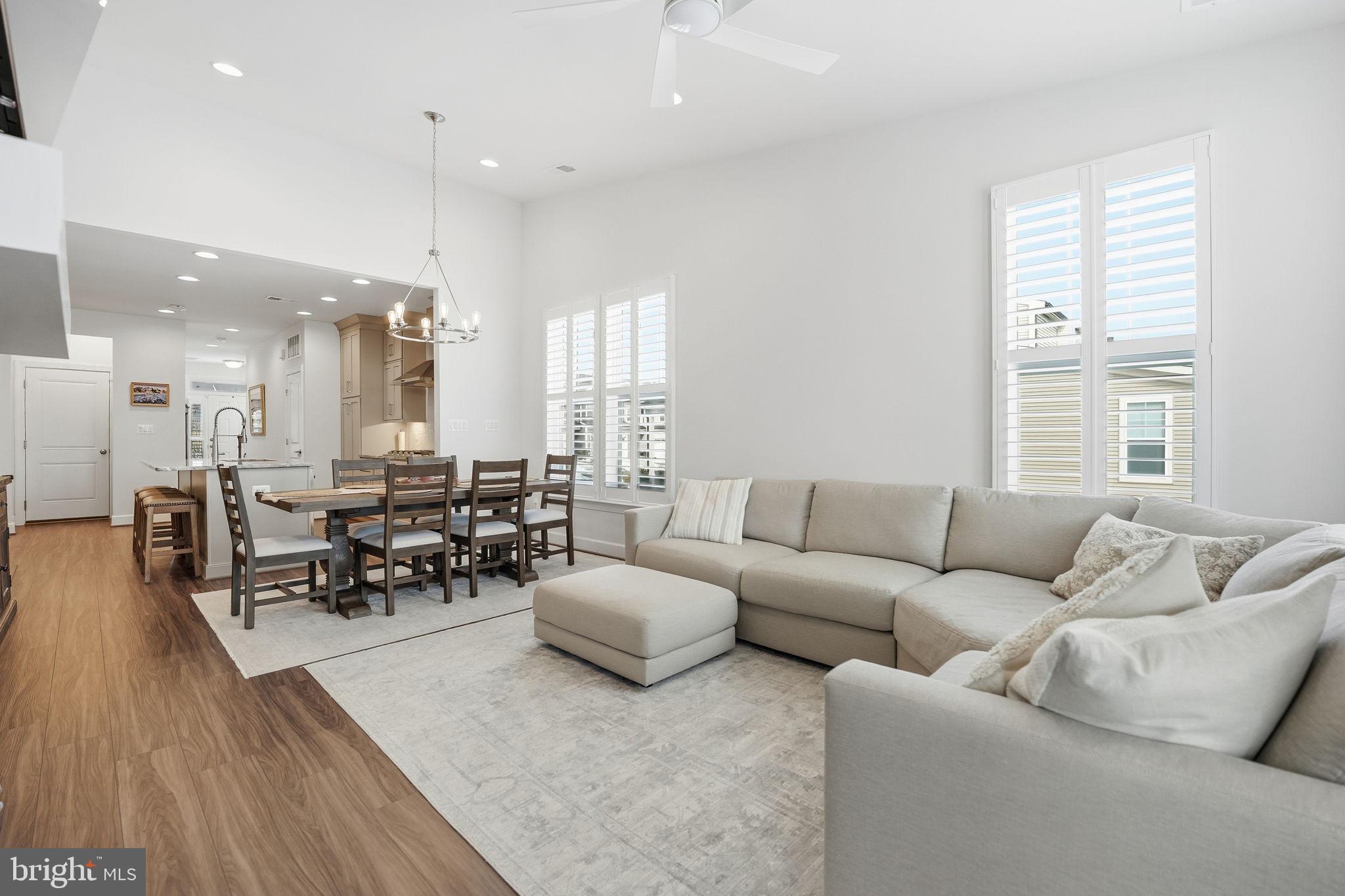151 Windflower Way Stafford, VA 22554 - Photo 17 of 88 a living room with furniture wooden floor and a large window