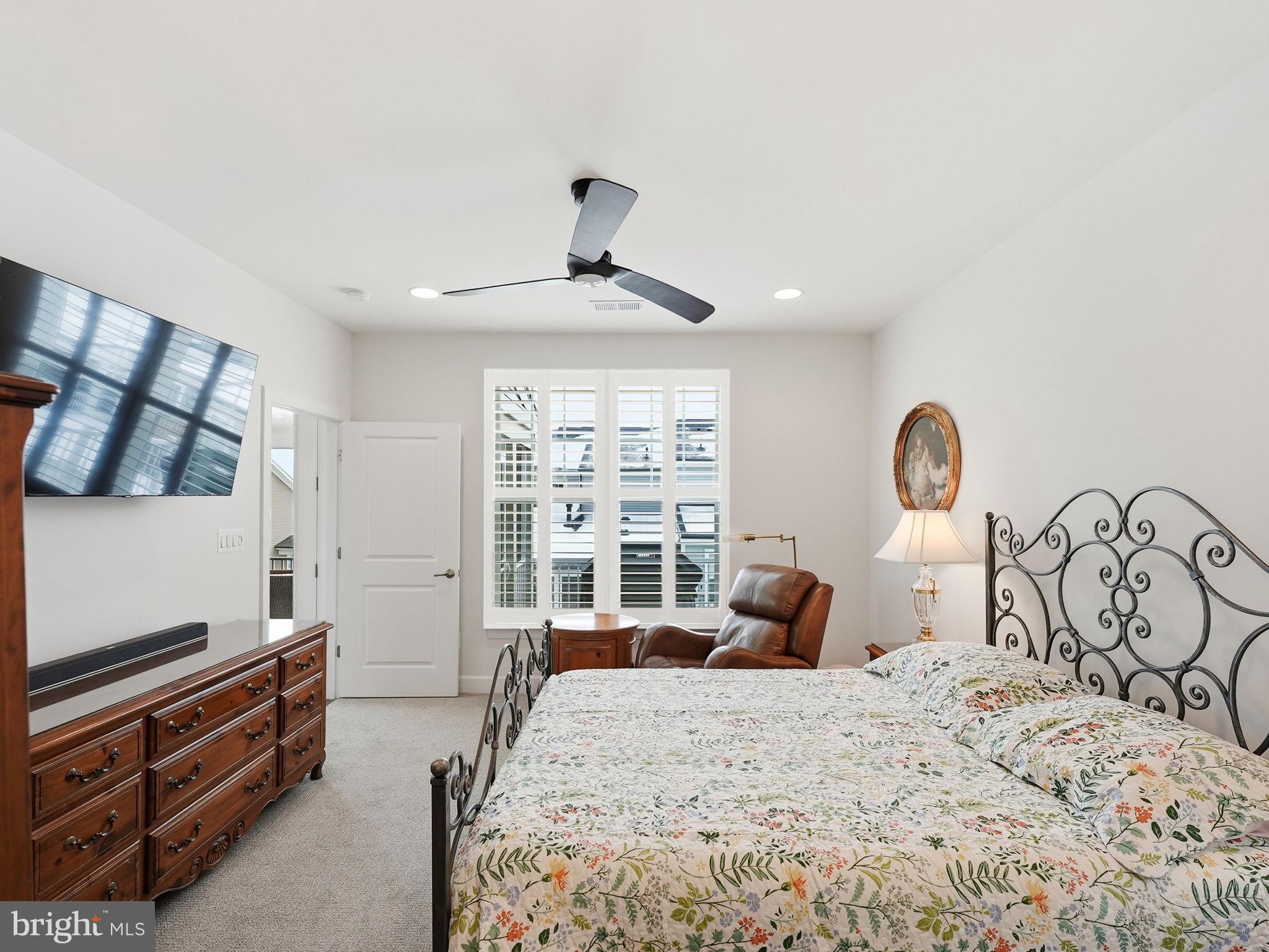 151 Windflower Way Stafford, VA 22554 - Photo 26 of 88 a bedroom with a bed and a dresser with mirror