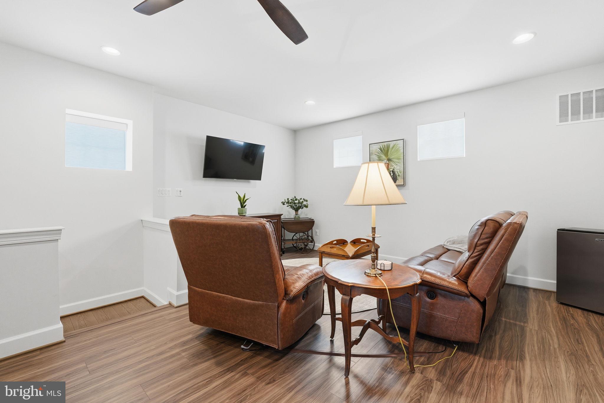 151 Windflower Way Stafford, VA 22554 - Photo 31 of 88 a living room with furniture and a flat screen tv
