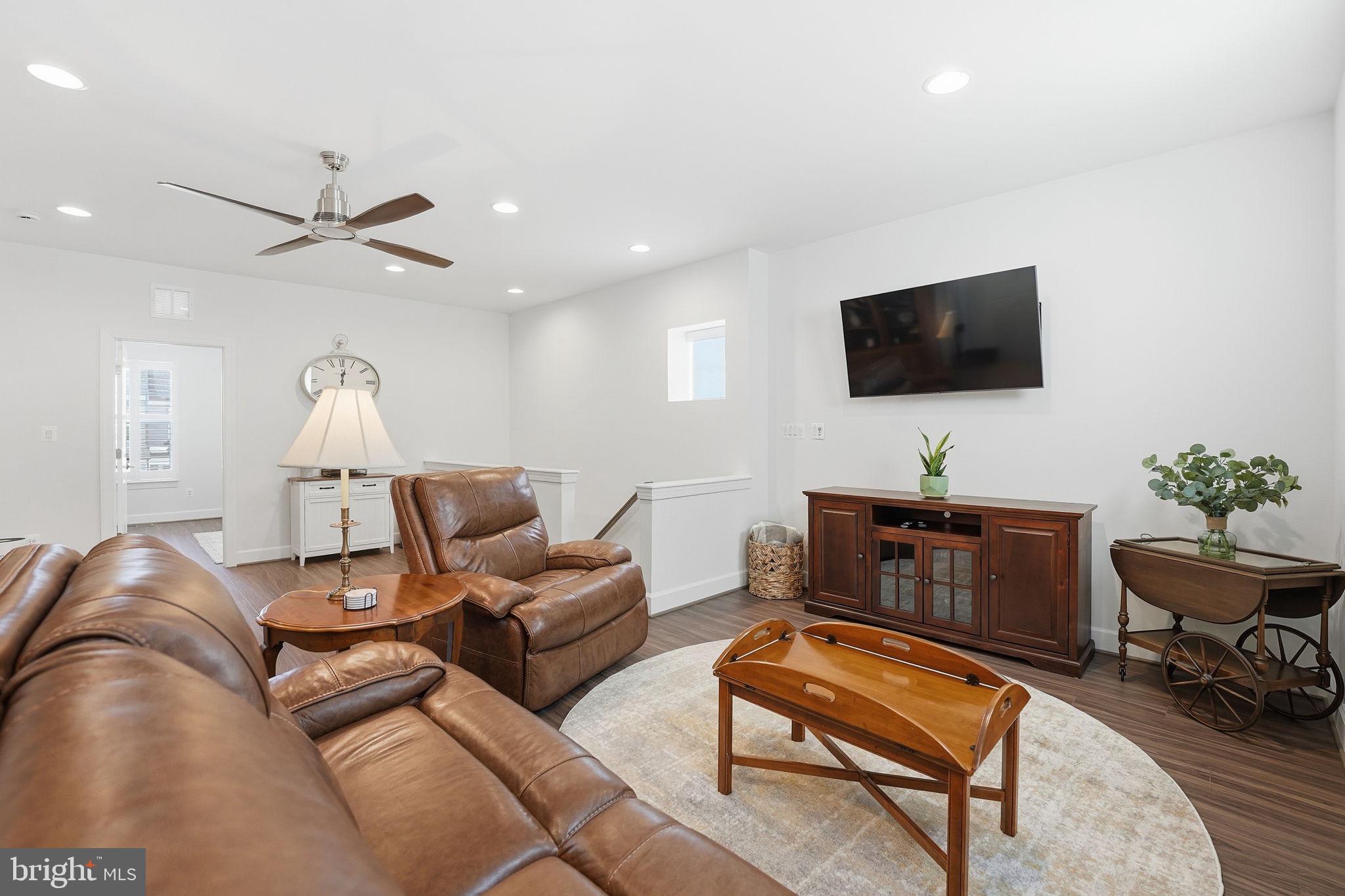 151 Windflower Way Stafford, VA 22554 - Photo 33 of 88 a living room with furniture and a flat screen tv