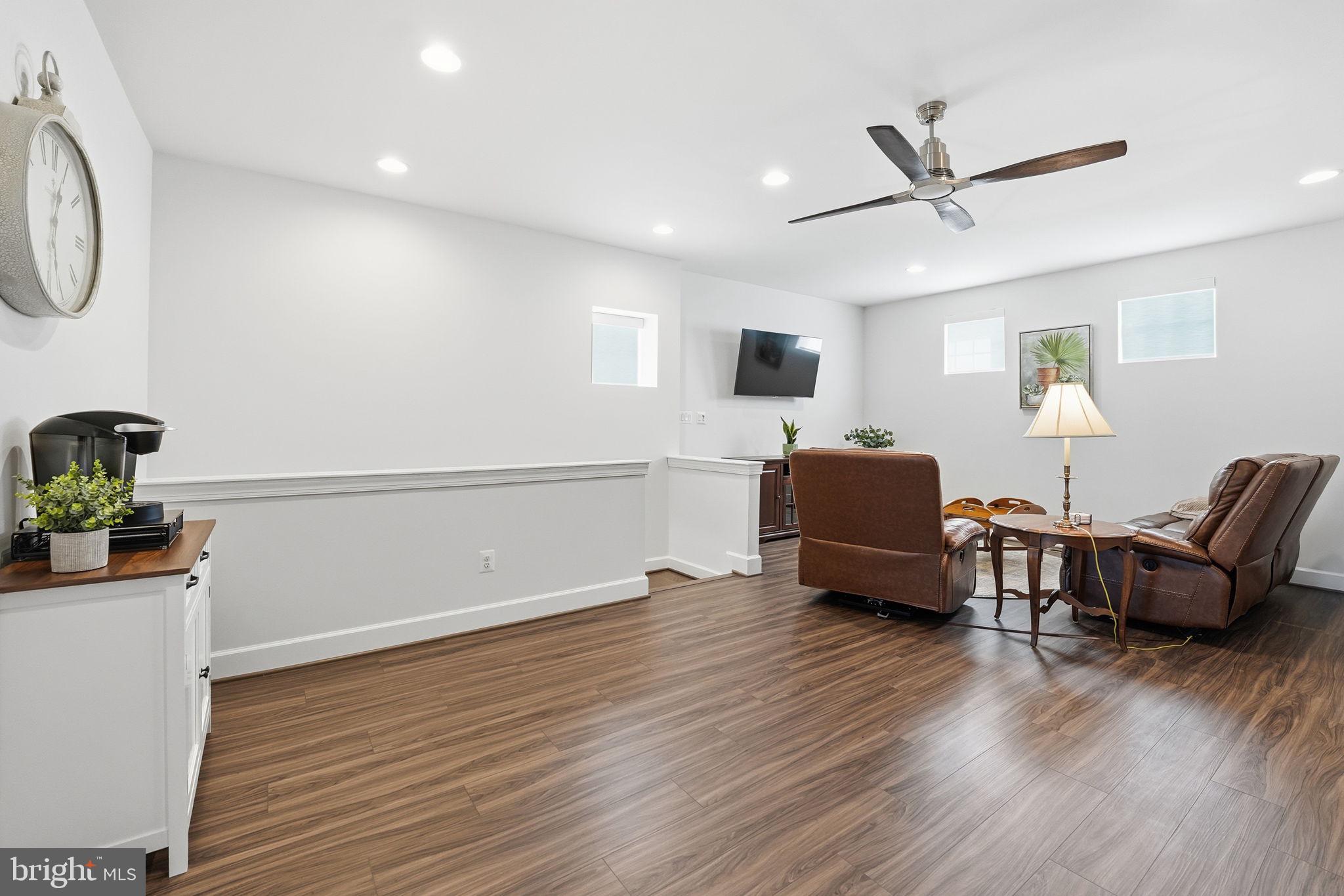 151 Windflower Way Stafford, VA 22554 - Photo 35 of 88 a living room with furniture and a wooden floor