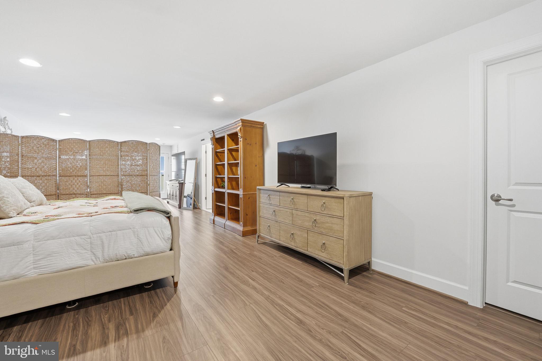 151 Windflower Way Stafford, VA 22554 - Photo 45 of 88 a spacious bedroom with a bed and a flat screen tv