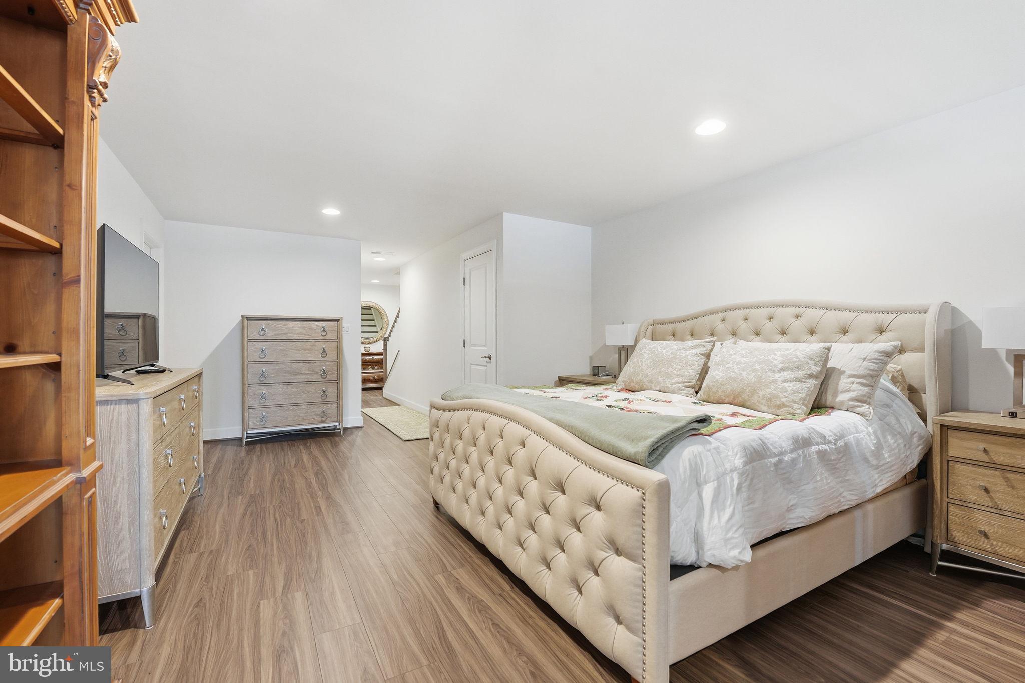 151 Windflower Way Stafford, VA 22554 - Photo 46 of 88 a bedroom with a bed and a flat screen tv