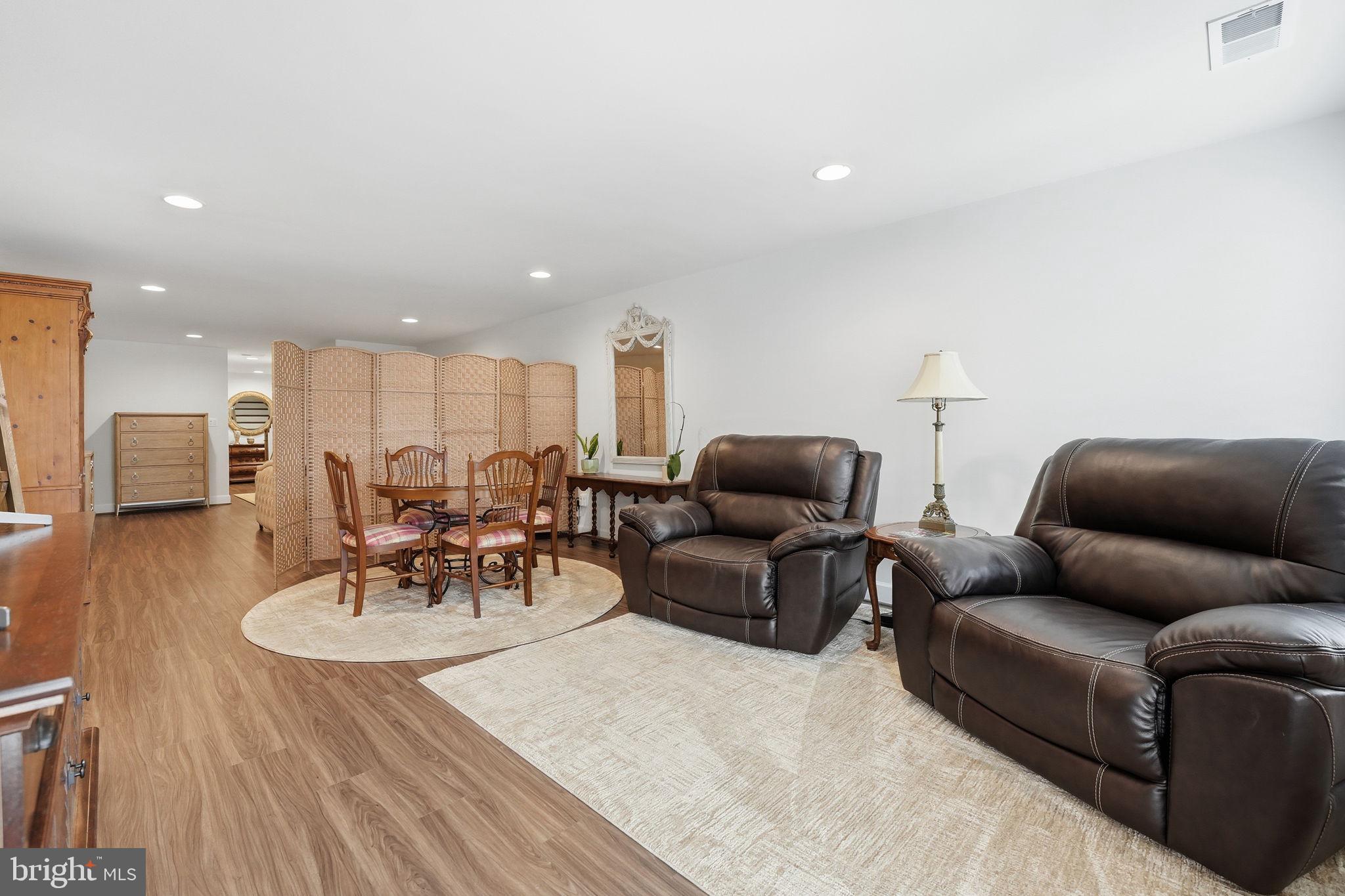 151 Windflower Way Stafford, VA 22554 - Photo 49 of 88 a living room with furniture and a wooden floor