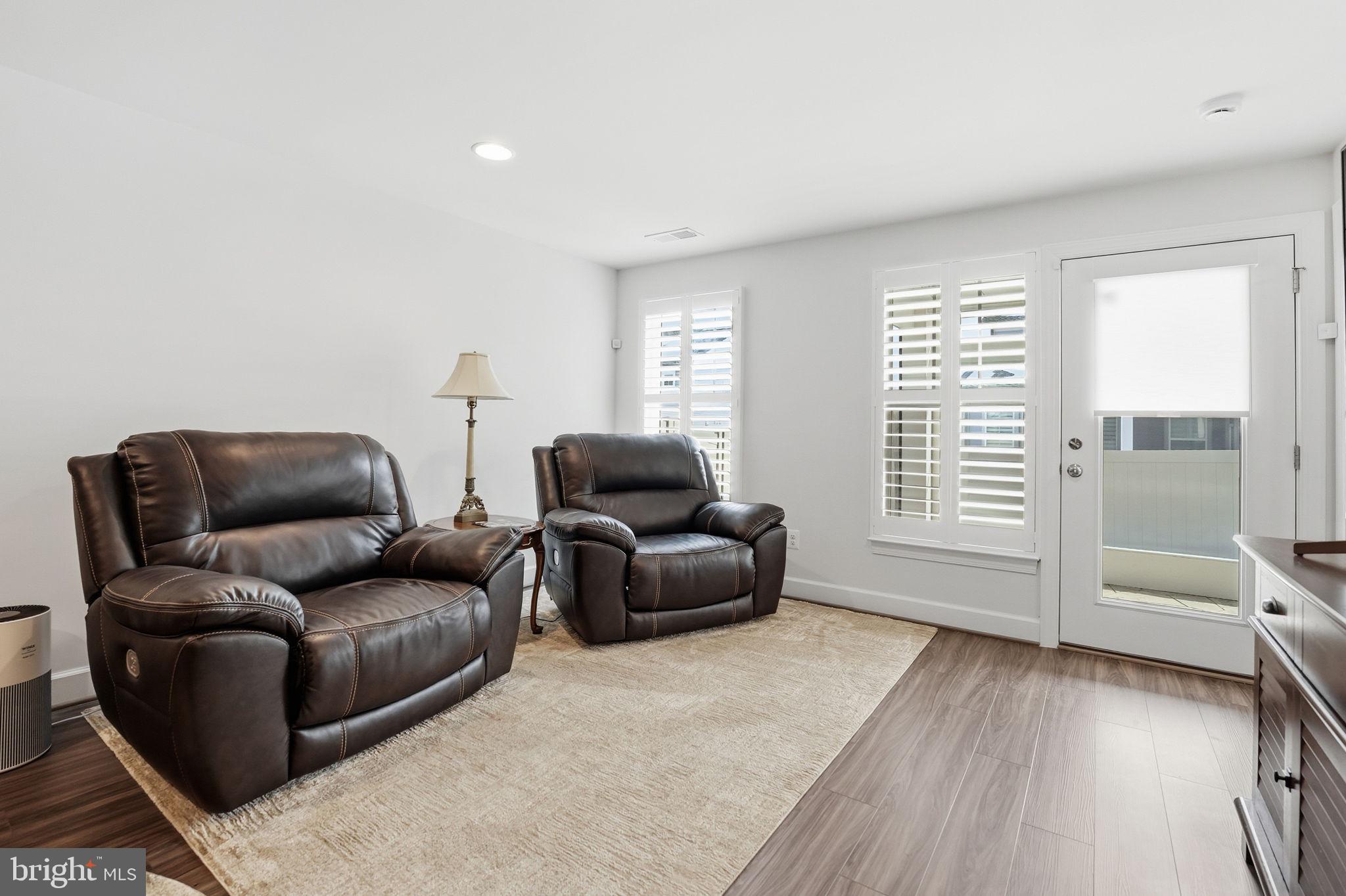 151 Windflower Way Stafford, VA 22554 - Photo 50 of 88 a living room with furniture and a flat screen tv