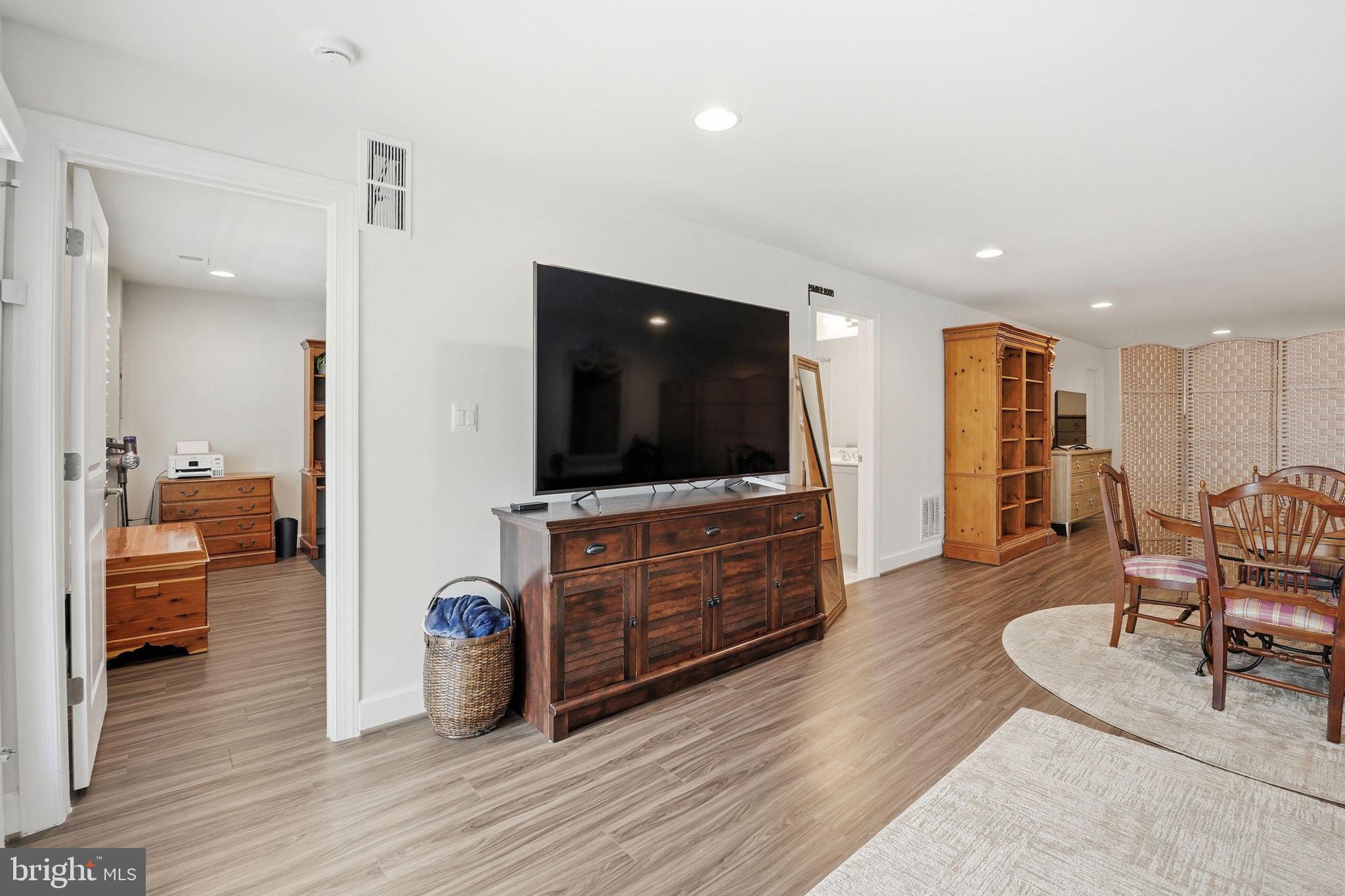 151 Windflower Way Stafford, VA 22554 - Photo 51 of 88 a living room with furniture and a flat screen tv