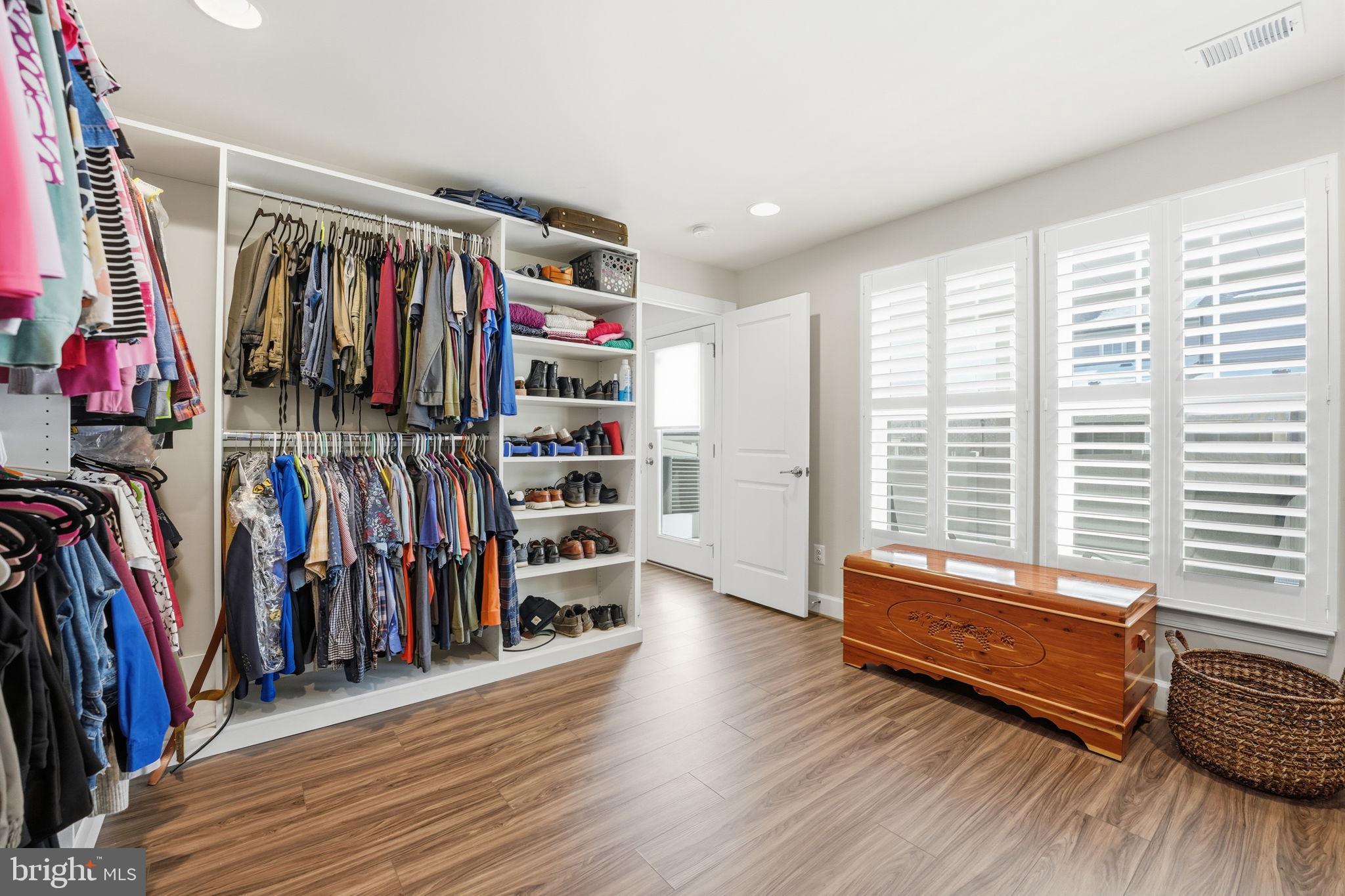 151 Windflower Way Stafford, VA 22554 - Photo 52 of 88 a view of walk in closet with clothes and shoes