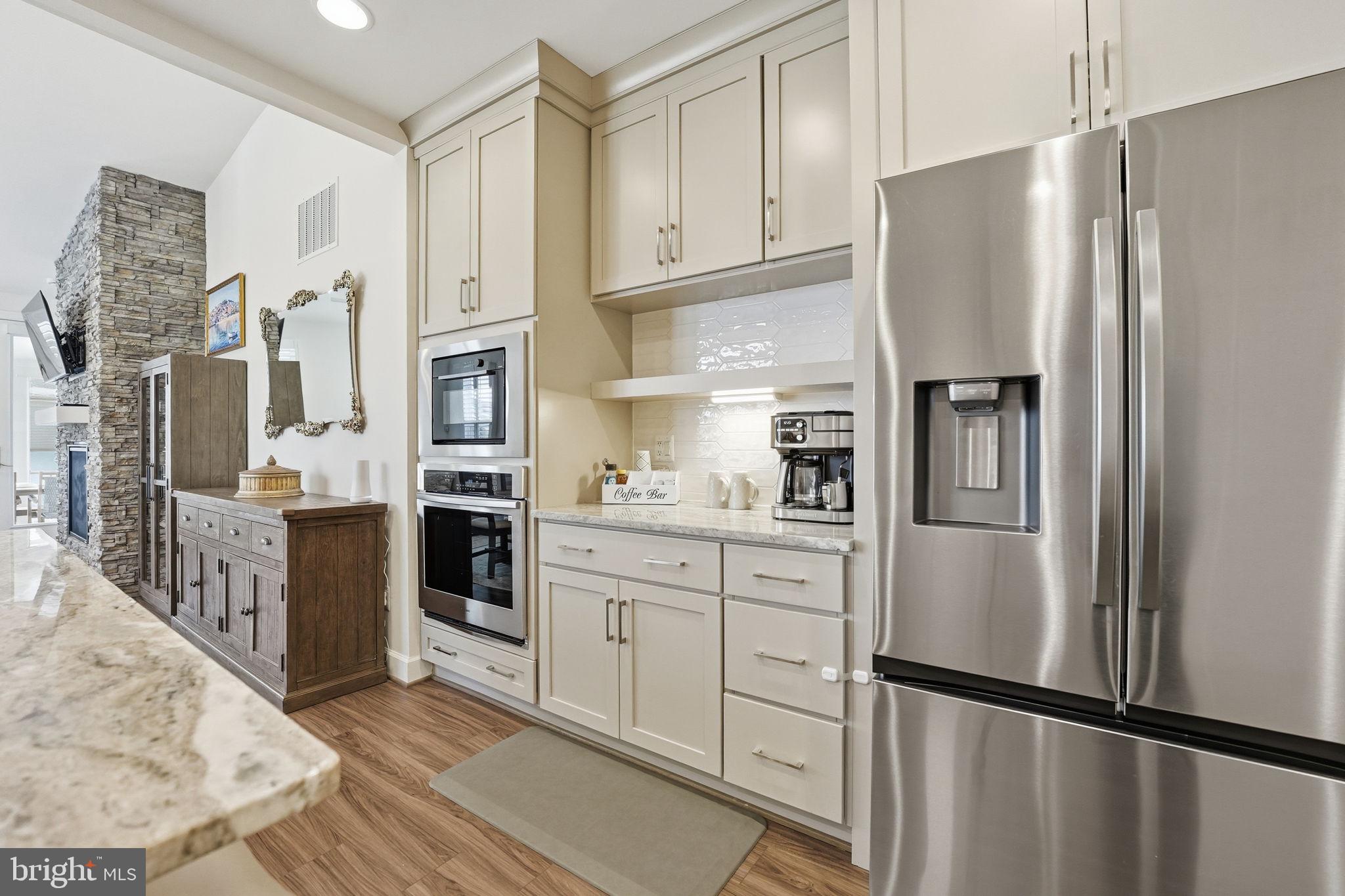 151 Windflower Way Stafford, VA 22554 - Photo 6 of 88 a kitchen with stainless steel appliances a refrigerator sink and cabinets