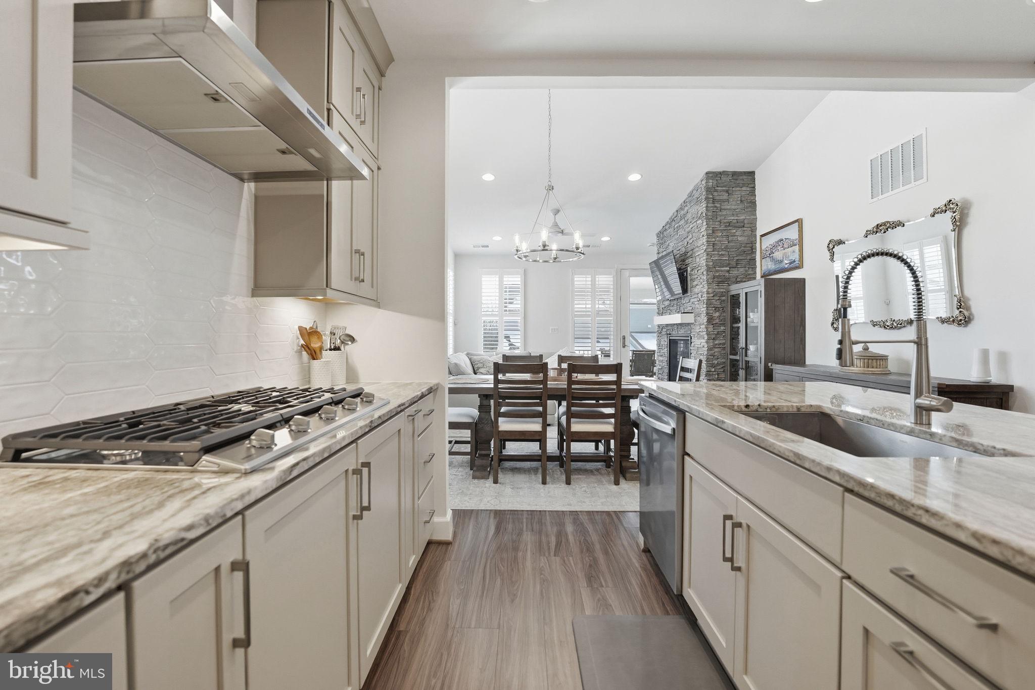 151 Windflower Way Stafford, VA 22554 - Photo 9 of 88 a kitchen with granite countertop a sink stove and cabinets