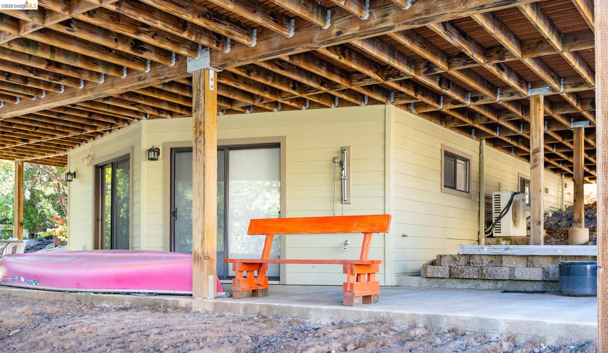 19711 Pleasantview Drive Groveland, CA 95321 - Photo 37 of 39 Covered patio area featuring a concrete slab, exposed wood joists, and sturdy support beams