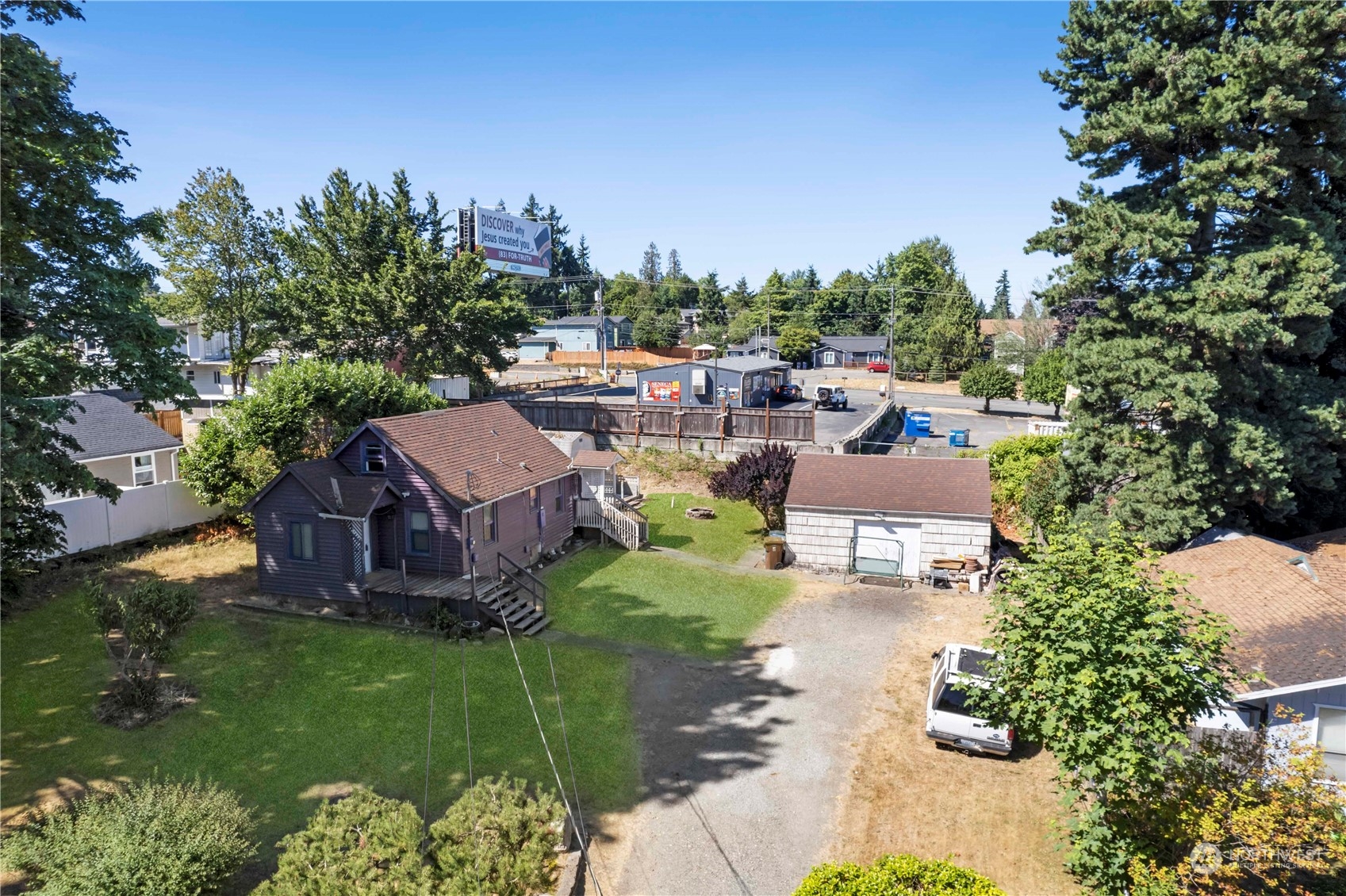 6215 28th Street Northeast Tacoma, WA 98422 - Photo 1 of 24 an aerial view of a house with garden space and street view