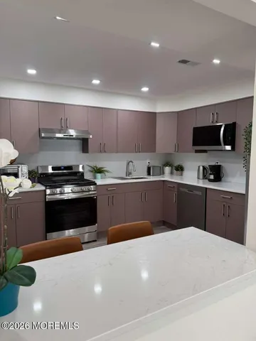 a spacious bedroom with a bed and a window