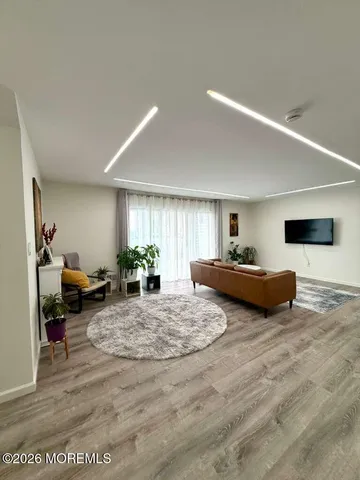 a large kitchen with stainless steel appliances kitchen island granite countertop a sink and cabinets