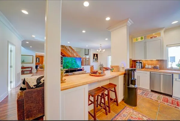 a view of a kitchen and dining room