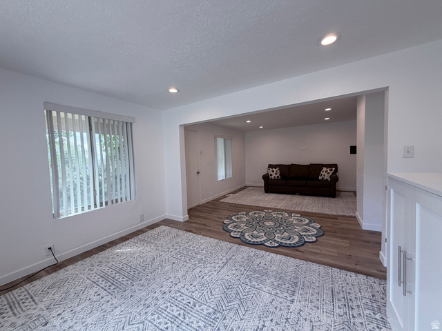 2855 South 1000 West Perry, UT 84302 - Photo 137 of 142 Sitting room featuring dark wood-style floors, recessed lighting, and a textured ceiling
