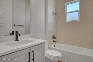 a bathroom with a sink toilet vanity and bathtub