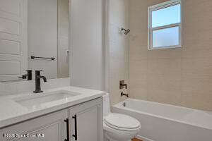 4195 Negal Circle Melbourne, FL 32901 - Photo 11 of 17 a bathroom with a sink toilet vanity and bathtub
