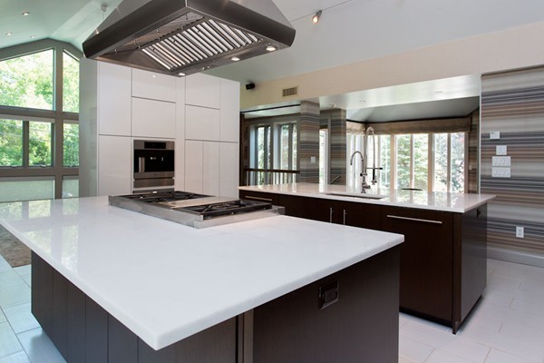 136 Laurel Road Brookline, MA 02467 - Photo 8 of 18 a kitchen with a stove and a refrigerator