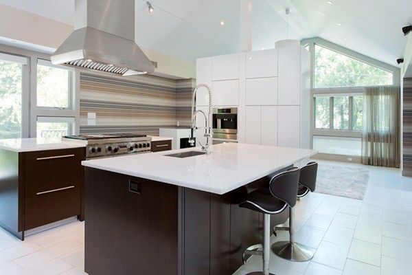 136 Laurel Road Brookline, MA 02467 - Photo 9 of 18 a kitchen with a sink a stove a table and chairs