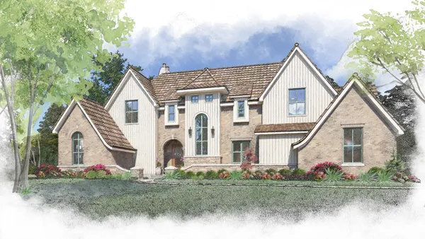 a view of a white house with large trees and yard