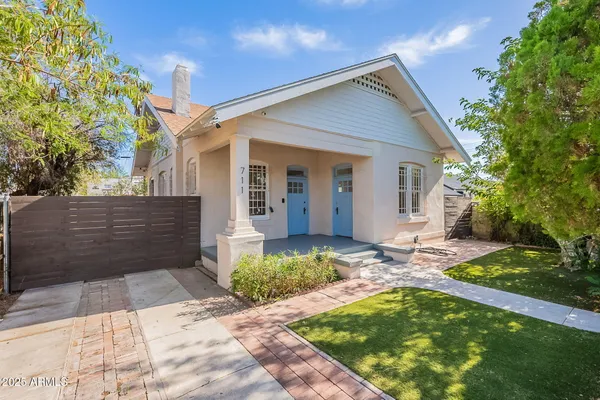 a front view of a house with garden