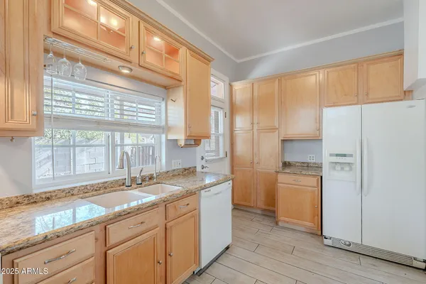 a kitchen with a refrigerator a sink and a stove
