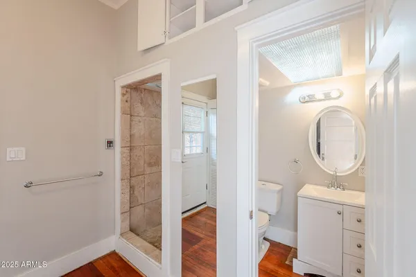 a bathroom with a glass shower door