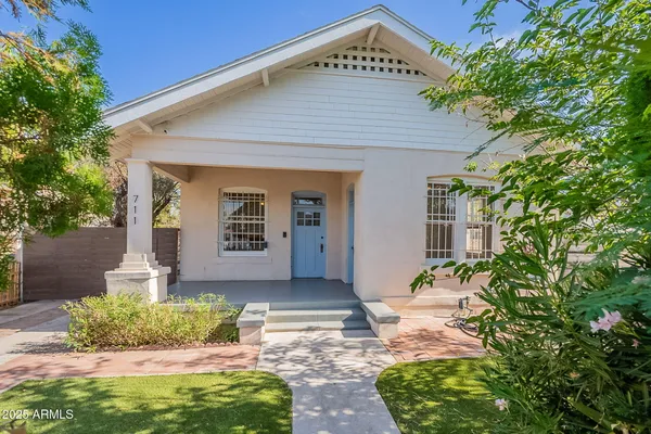 a front view of a house with garden