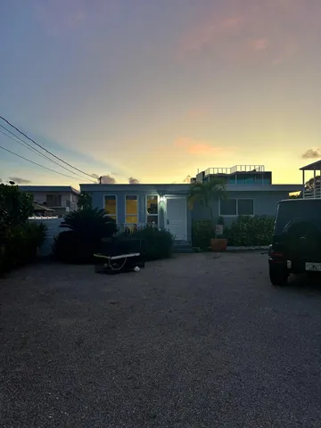 a view of house with car parked