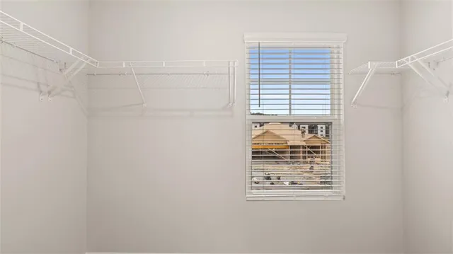 a view of an empty room and a window