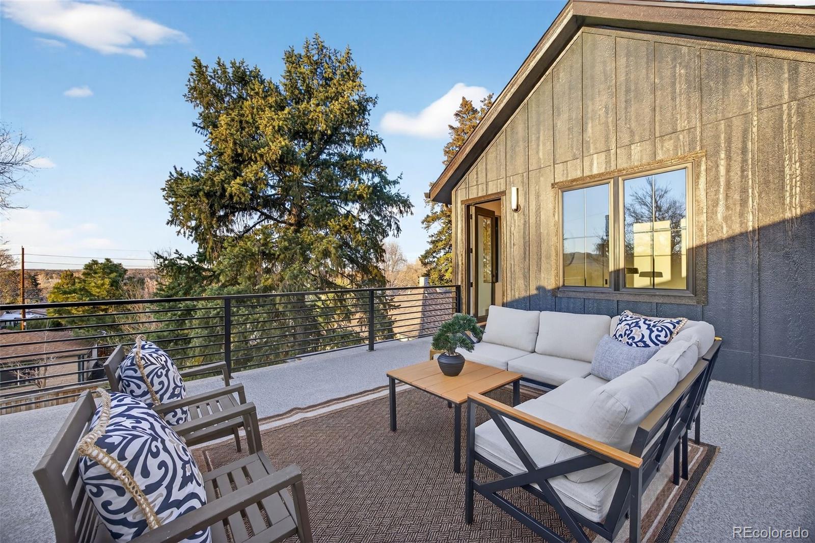 5175 Raleigh Street Denver, CO 80212 - Photo 30 of 49 a balcony with furniture and a potted plant